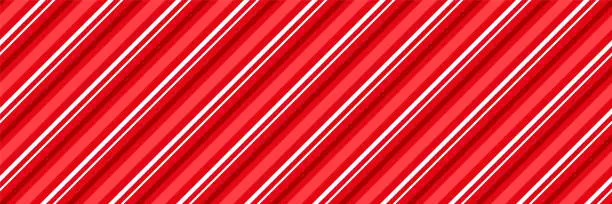 Vector illustration of Christmas red striped, candy cane, peppermint background diagonal stripes print seamless pattern