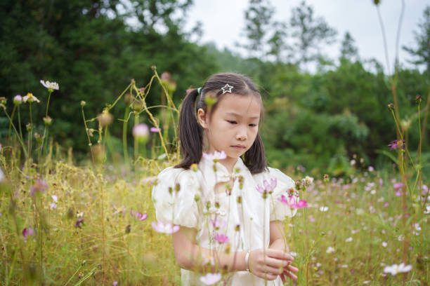 istock children picking flowers 1719679913