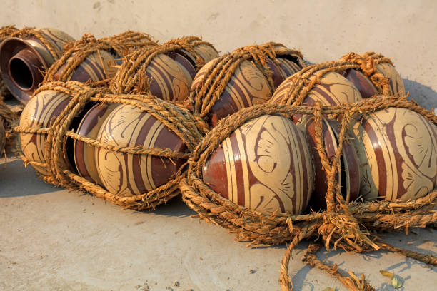 istock Traditional Chinese pickle jars are wrapped in straw ropes 1719700154