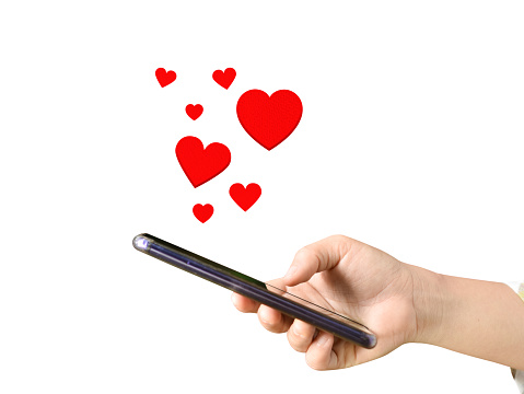 Hands holding mobile phone with hearts, Love symbol on transparent background.