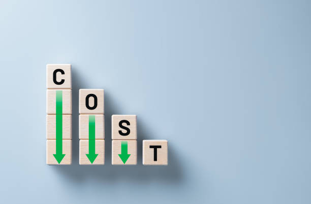 istock Lean and Cost reduction concept. Decreasing company expenses to maximize profits. Stacked wooden cube with word cost and green down arrows. Business improvement, manufacturing optimization management. 1719732264