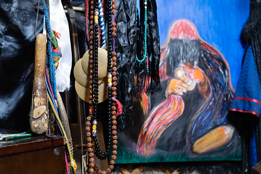 Ulaanbaatar, Mongolia - October 3, 2023: Necklaces and a painting of a shaman at a shrine inside a ger (yurt).