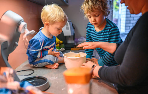 istock Mother and Sons Baking Bread in the Morning 1719759394