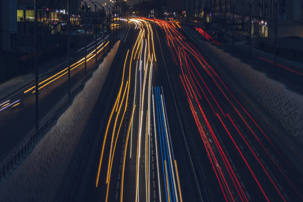 istock City road background with automobile light trails blurred headlights in the evening 1719821924