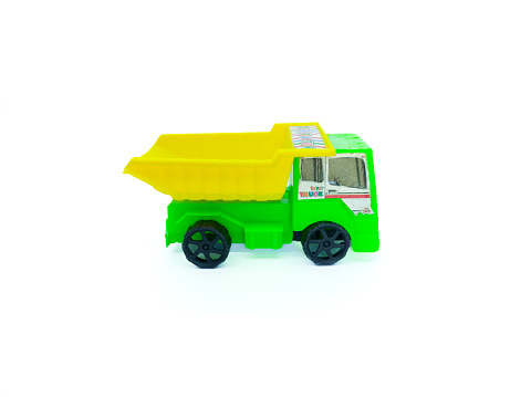 yellow green toy truck on a white background