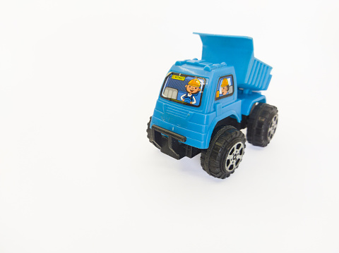object photo of a light blue toy truck from the front on a white background