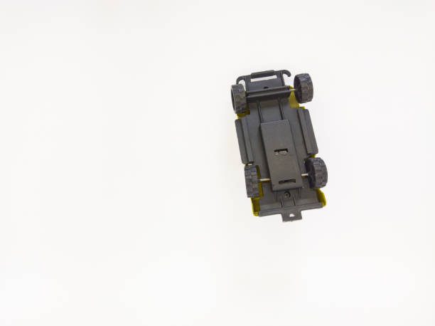 istock toy car made of plastic upside down on a white background 1719846867
