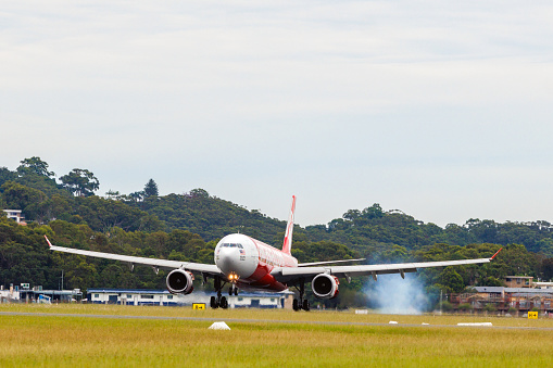 Gold Coast, Australia - April1, 2023: Air Asia X Airbus A330 touching down at Gold Coast Airport from Kuala Lumpur, Malaysia