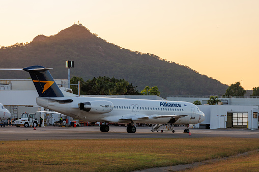 Townsville, Australia - 10 August 2022: Alliance Airlines Fokker 100 flight taxiing at Townsville airport in north Queensland, Australia