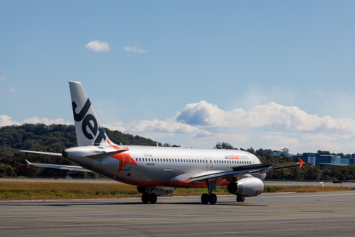 Gold Coast, Australia - 21 July 2021: JetstarAirbus A320 taxiing at Gold Coast Airport (OOL) in preparation for takeoff.