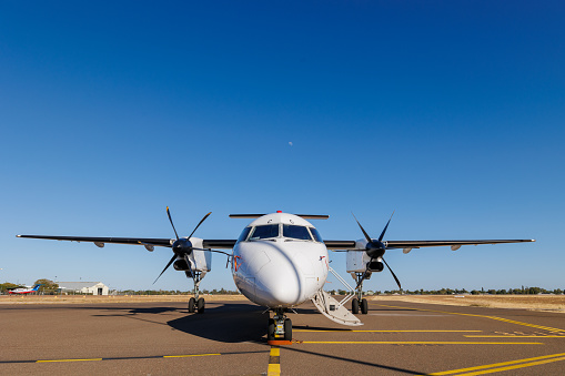 Longreach, Queensland - 29 June 2021: QantasLink Bombardier DHC-8 on the tarmac at Longreach Airport (LRE) in outback Queensland