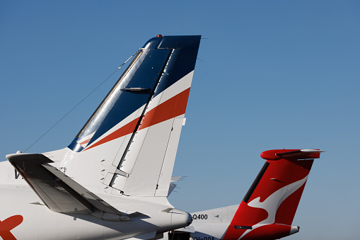 Mount Isa, Queensland - 27 July 2021: Rex Airlines and QantasLink tails at Mount Isa airport in outback Queensland.