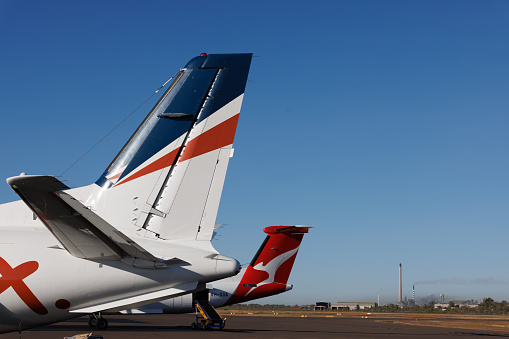 Mount Isa, Queensland - 27 July 2021: Rex Airlines and QantasLink tails at Mount Isa airport in outback Queensland.