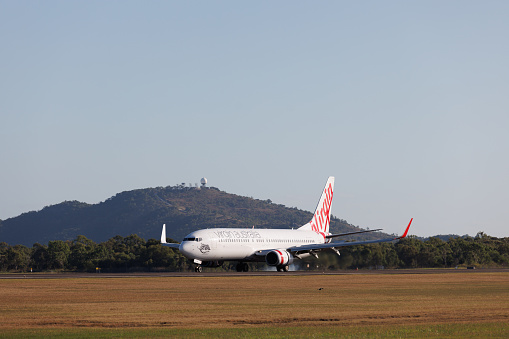 Townsville, Australia - 10 August 2022: Virgin Australia Boeing 737-800 touching down at Townsville Airport (TSV)