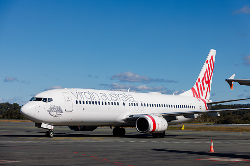 Gold Coast, Australia - 21 July 2021: Virgin Australia Boeing 737-800 taxiing at Gold Coast Airport (OOL) in preparation for takeoff.