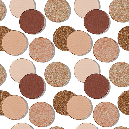 Seamless pattern with eye shadow swatches, beige brown natural colors on white background. Eyeshadows powder for make up, shiny and matte, minimal aesthetic photo, pastel color, top view, flat lay