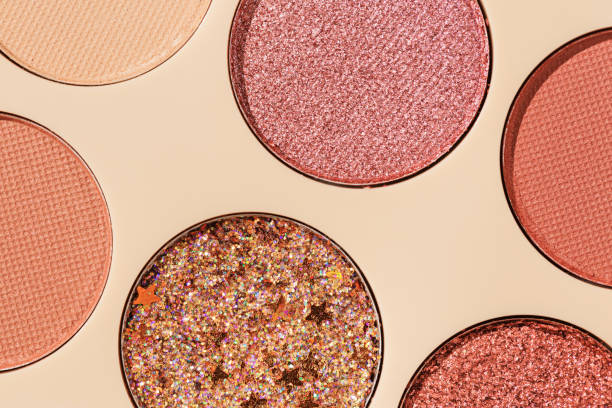 istock Close up minimal pattern with colorful eye shadow samples, trend color swatches on beige background. Eyeshadows powder with glitters for makeup, shiny and matte, aesthetic photo, top view 1719860899