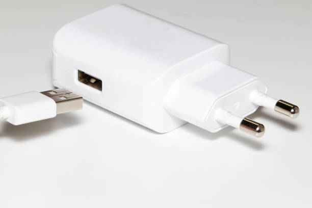 istock Close up, USB cord and USB 220V Power Adapter isolated on White Background. 1719866857
