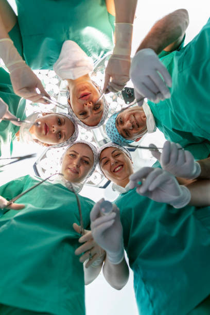 istock Team of nurses and surgeons in surgery. 1719911150