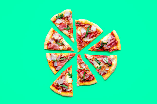 istock Ham pizza top view minimalist on a green table 1719925906