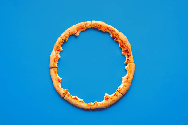istock Pizza crust leftovers top view on a blue background 1719926524