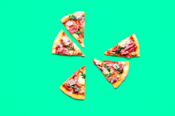 istock Pizza prosciutto slices minimalist on a green background 1719927609