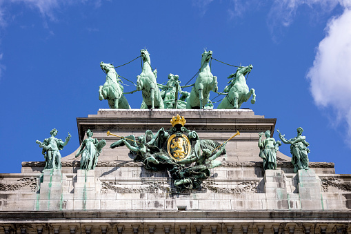 Brussels, Belgium - May 16, 2023: Statue of quadriga on the top of triumphal arch Cinquantenaire Arch in Cinquantenaire Park