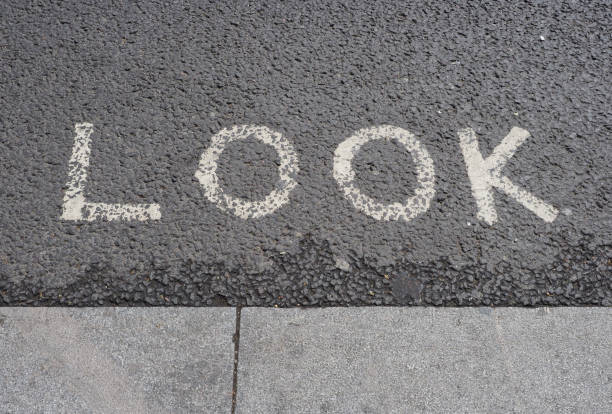 istock look sign painted on tarmac 1719967457