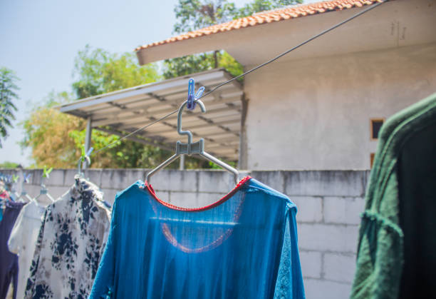 istock Women's clothes are drying in the backyard 1719972578