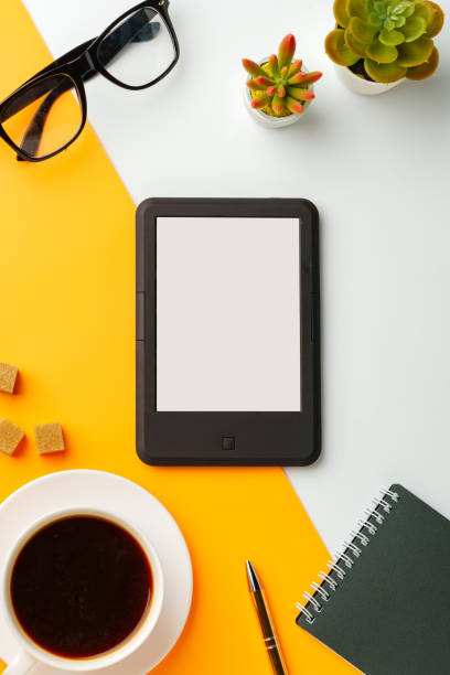 istock E-book reader with coffee cup and glasses on white and yellow background 1720003894
