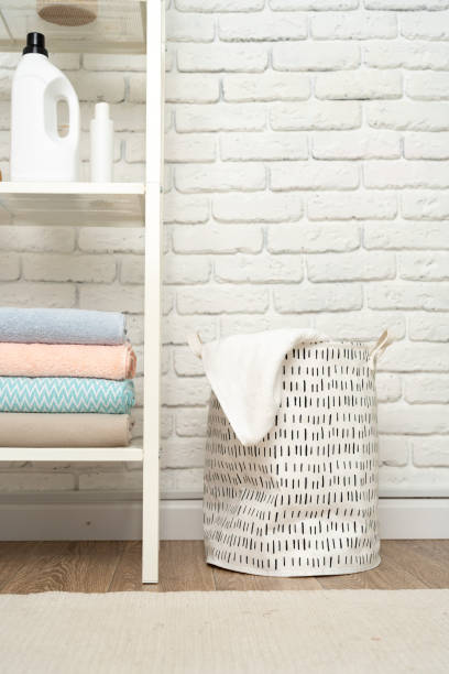istock Fabric laundry basket in a bathroom close up 1720013075
