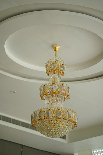 A chandelier hanging in a Regency room.