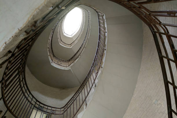 istock An old spiral staircase with an upward view. 1720046832
