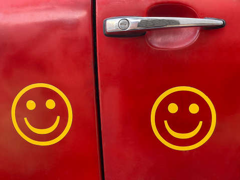 Smiley faces on vehicle door.