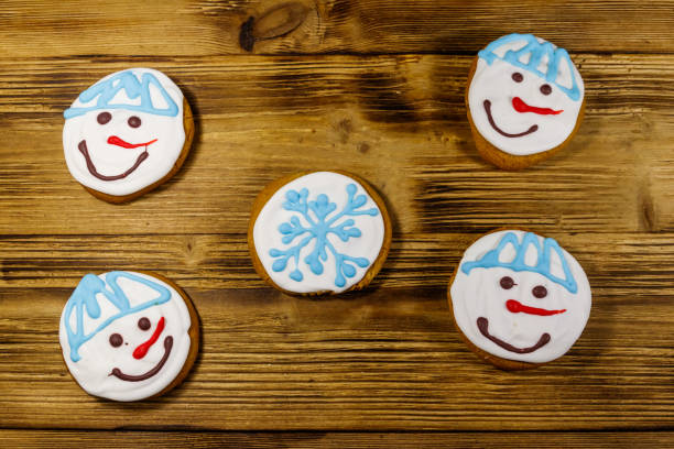 Christmas gingerbread cookies on a wooden background. Top view