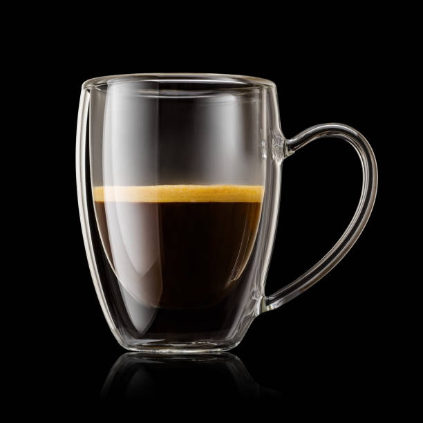 istock Transparent double wall glass mug with espresso coffee on black background. 1720088455