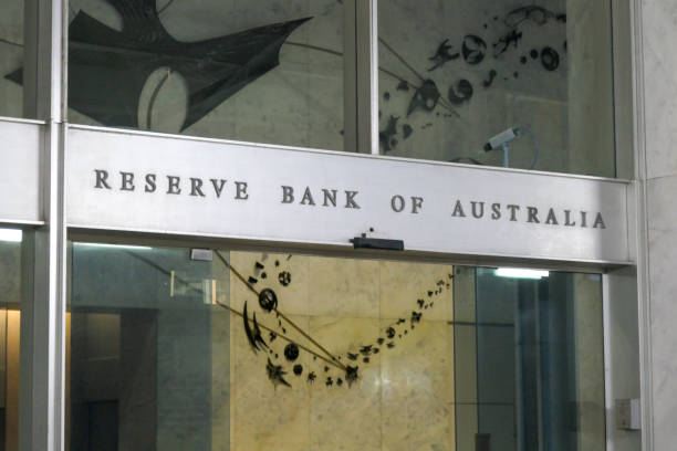 Reserve Bank of Australia Entrance The main pedestrian entrance of the Reserve Bank of Australia building at 65 Martin Place in the central business district (CBD) of Sydney. The automatic glass doors are briefly open. Three armed guards (not shown here) guard the foyer. This image was taken from outside the building in Martin Place, looking through the glass facade, on an overcast afternoon on 6 October 2023. art name plates stock pictures, royalty-free photos & images