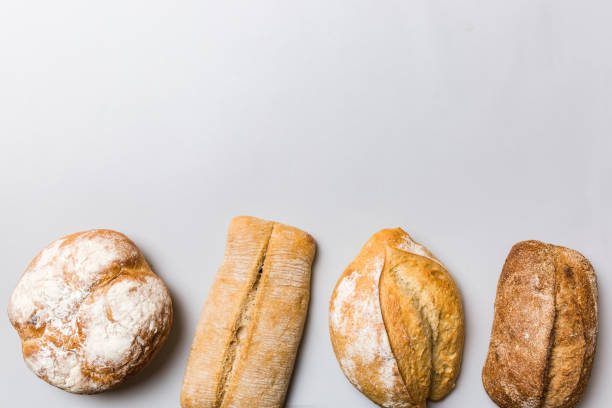 istock Homemade natural breads. Different kinds of fresh bread as background, top view with copy space 1720144066