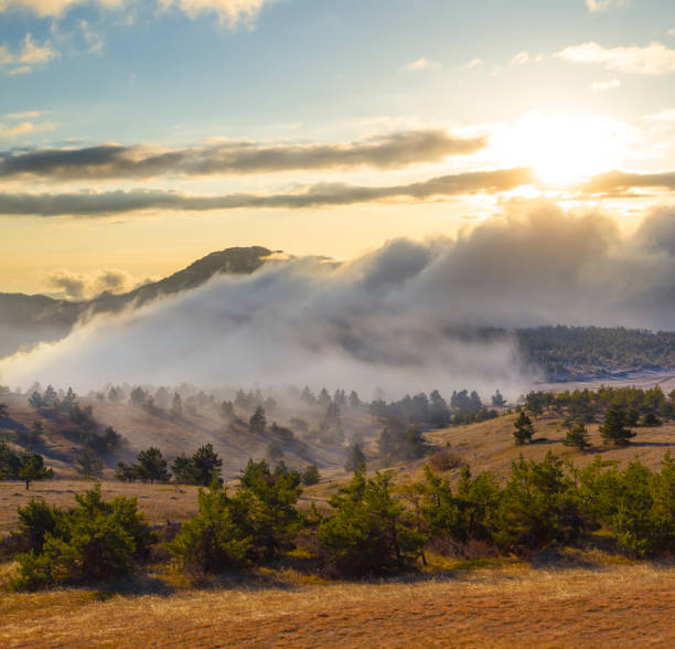 istock mountain valley in dense mist and clouds at the sunset 1720151359