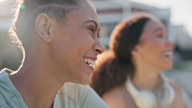 Fitness, conversation and girl friends laughing for a comic or funny joke after an outdoor workout. Gen z, smile and happy young women talking, bonding and relaxing after sports training or exercise.