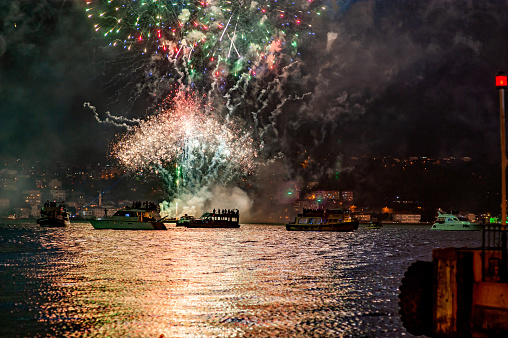 Fireworks display on the Bosphorus and tourists watching on the boat - 29 October Republic Day celebration event