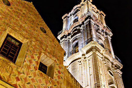 Tower of the Church of San Juan Bautista in Malaga, Andalusia. Night photo, selective focus