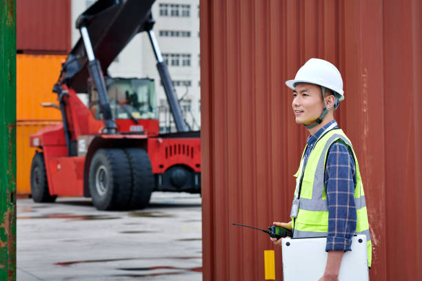 istock One Asian Male Worker Coordination Work at Commercial Dock 1720192614