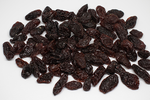 Dried raisins on isolated background