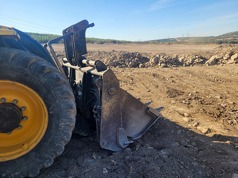 Bulldozer working on leveling the land area