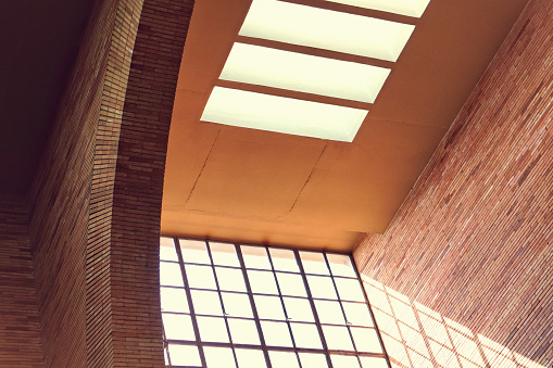 Architectural abstract, red brick, window, skylight, shadow and light, modern