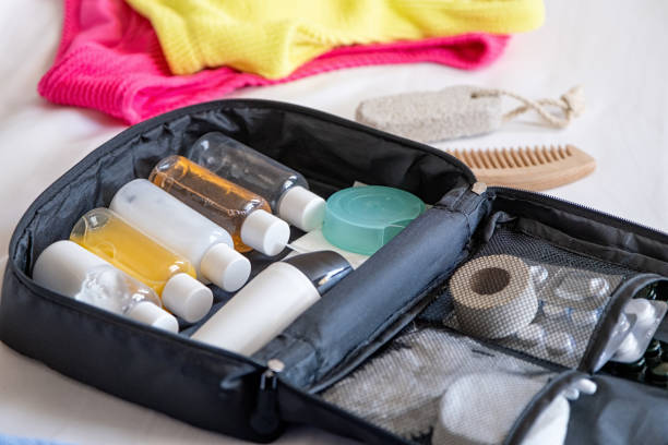Travel cosmetics kit on bed , top view