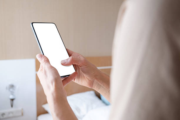 istock closeup of female hands using smartphone, white blank screen for mockup 1720242048