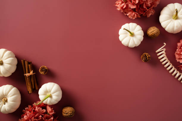 istock Autumn frame of white pumpkins and fall decorations on brown background. Flat lay, top view, copy space. 1720252235
