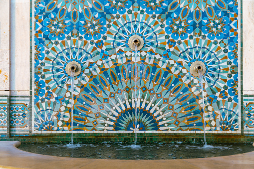 The Hassan II Mosque exterior water fountain decorated with a beautiful moroccan mosaic pattern in Casablanca, Morocco.